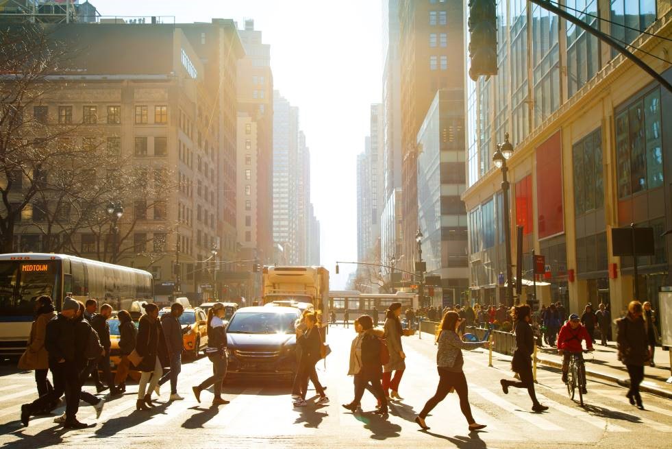 Pedestrians crossing a city crosswalk